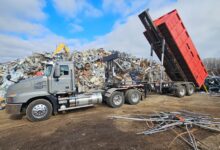 All American Recycling Truck Dumping Scrap Metal.