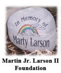 A memorial stone with a rainbow and clouds reads In Memory of Marty Larson. Below the stone, text says Martin Jr. Larson II Foundation.